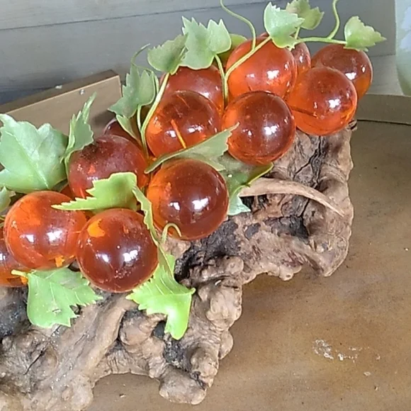 Vintage 1970s large orange lucien grapes on driftwood